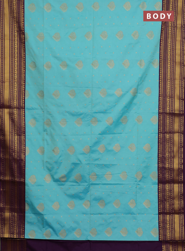 Semi soft silk saree teal shade and purple with allover zari woven buttas and zari woven border