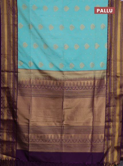 Semi soft silk saree teal shade and purple with allover zari woven buttas and zari woven border