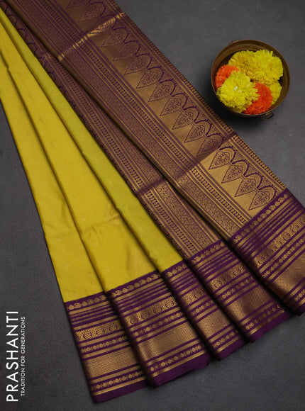 Semi soft silk saree pale yellow and purple with allover zari woven buttas and zari woven border