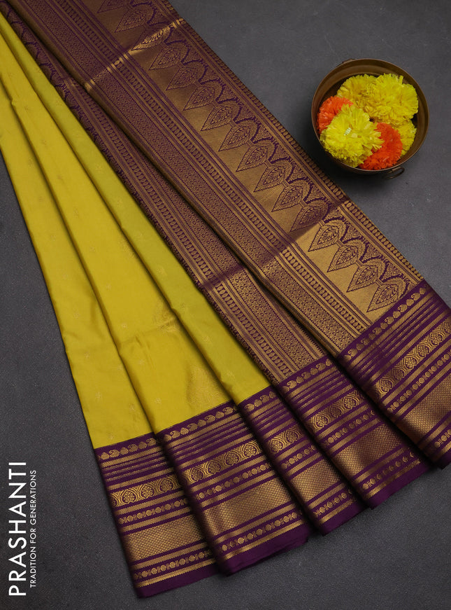 Semi soft silk saree pale yellow and purple with allover zari woven buttas and zari woven border
