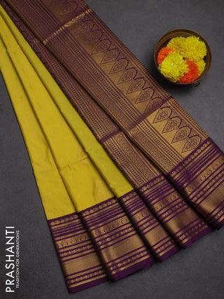 Semi soft silk saree pale yellow and purple with allover zari woven buttas and zari woven border