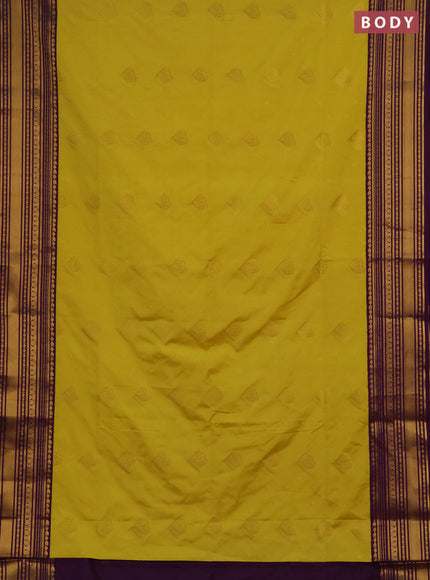 Semi soft silk saree pale yellow and purple with allover zari woven buttas and zari woven border