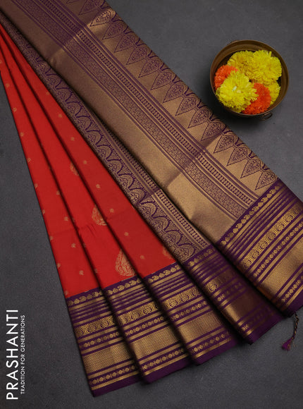 Semi soft silk saree rustic orange and purple with allover zari woven buttas and zari woven border