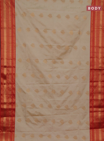 Semi soft silk saree beige and dual shade of red with allover zari woven buttas and zari woven border