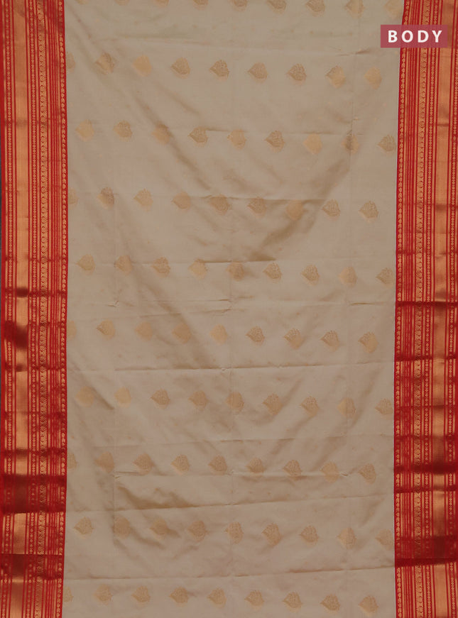 Semi soft silk saree beige and dual shade of red with allover zari woven buttas and zari woven border