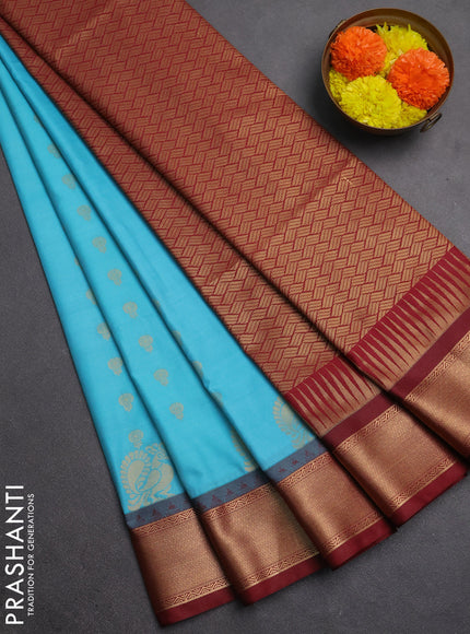 Semi soft silk saree teal blue and maroon with allover zari woven buttas and rich zari woven border