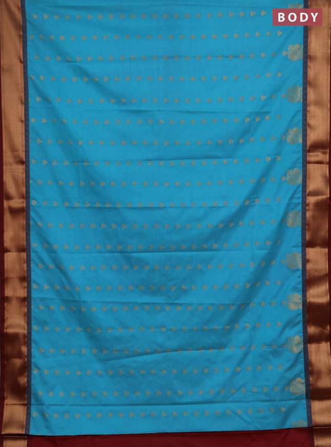 Semi soft silk saree teal blue and maroon with allover zari woven buttas and rich zari woven border