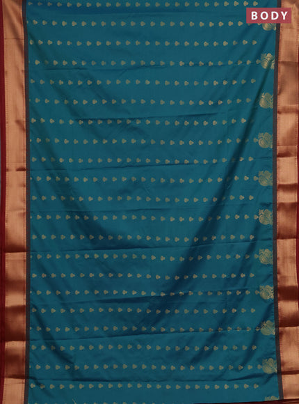 Semi soft silk saree peacock green and maroon with allover zari woven buttas and rich zari woven border