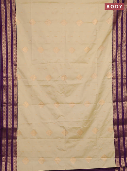 Semi soft silk saree beige and purple with allover zari woven buttas and zari woven border