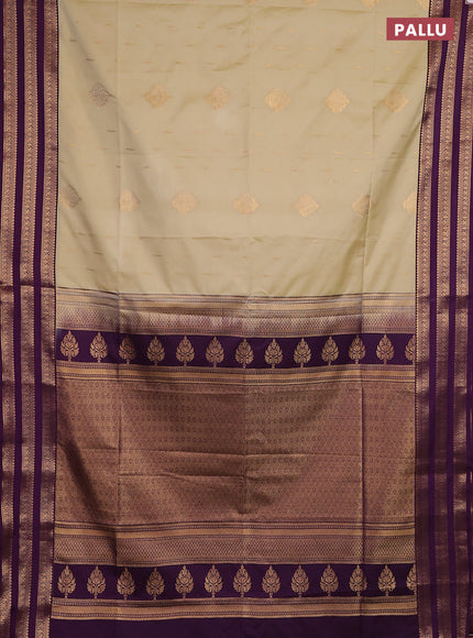 Semi soft silk saree beige and purple with allover zari woven buttas and zari woven border