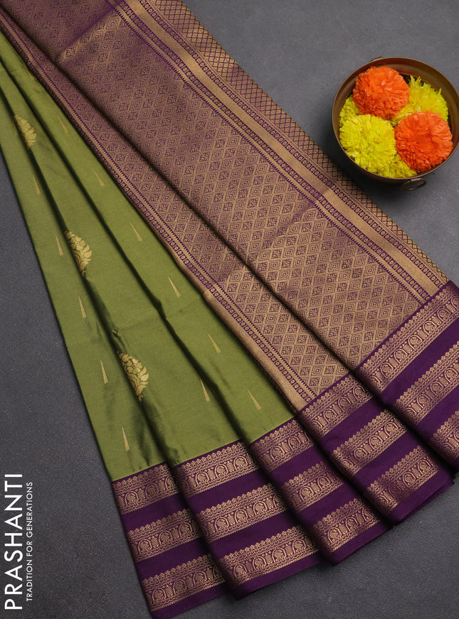 Semi soft silk saree green and purple with allover zari woven buttas and zari woven border