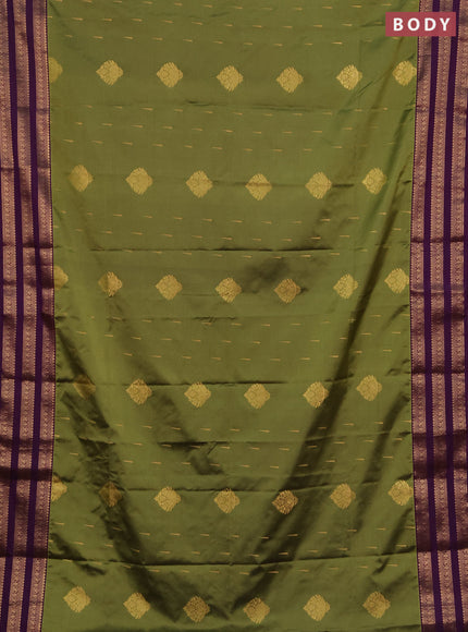 Semi soft silk saree green and purple with allover zari woven buttas and zari woven border
