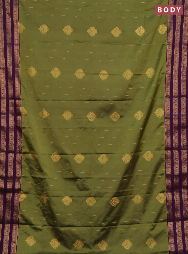 Semi soft silk saree green and purple with allover zari woven buttas and zari woven border
