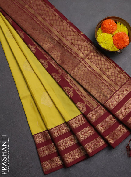 Semi soft silk saree yellow shade and maroon with allover zari woven buttas and zari woven border