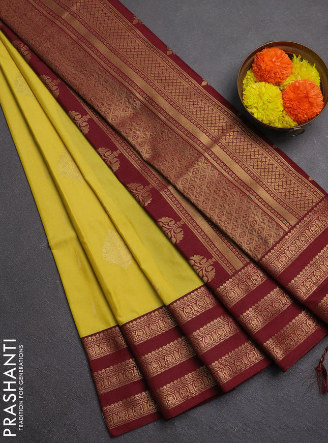 Semi soft silk saree yellow shade and maroon with allover zari woven buttas and zari woven border