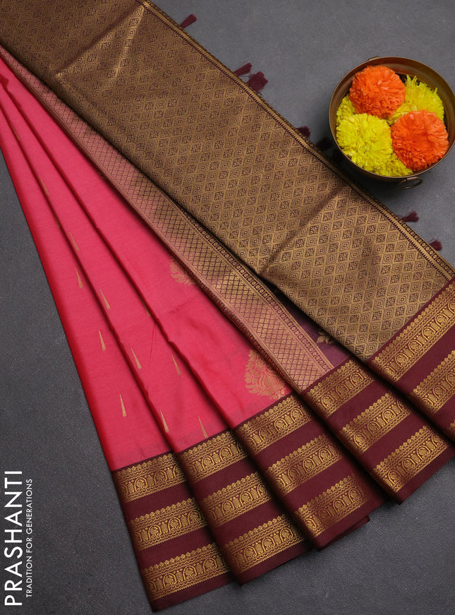 Semi soft silk saree tomato pink shade and maroon with allover zari woven buttas and zari woven border