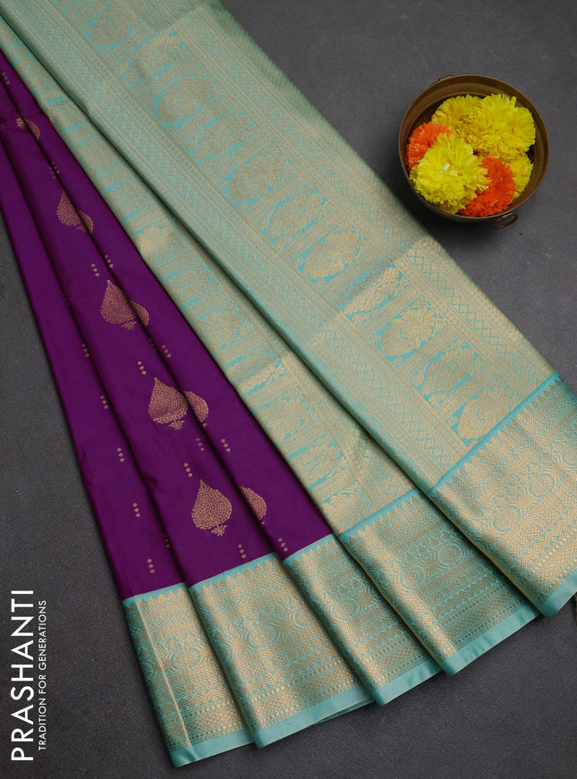 Semi soft silk saree purple and teal shade with allover zari woven buttas and zari woven border