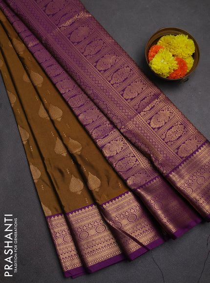 Semi soft silk saree dark mustard and purple with allover zari woven buttas and zari woven border