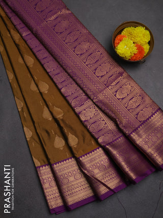 Semi soft silk saree dark mustard and purple with allover zari woven buttas and zari woven border