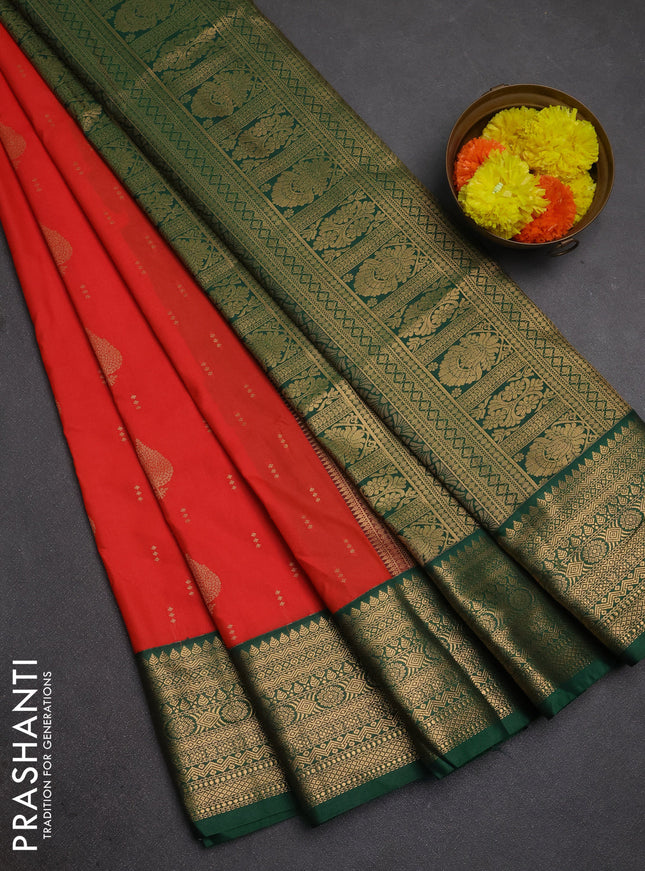 Semi soft silk saree orange and green with allover zari woven buttas and zari woven border