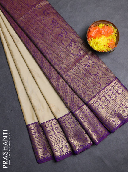 Semi soft silk saree beige and purple with allover zari weaves & buttas and zari woven border