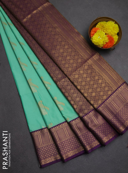 Semi soft silk saree mild teal green and purple with allover zari woven buttas and zari woven border