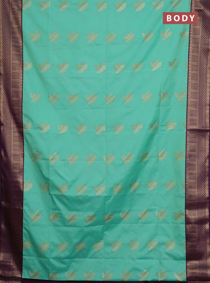 Semi soft silk saree mild teal green and purple with allover zari woven buttas and zari woven border