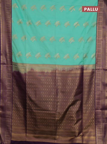 Semi soft silk saree mild teal green and purple with allover zari woven buttas and zari woven border
