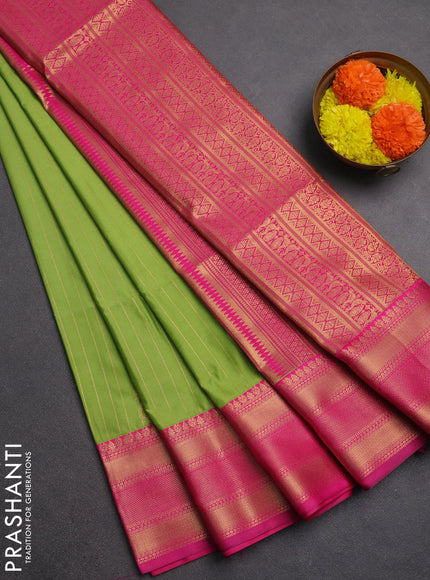 Semi soft silk saree light green and pink with allover zari weaves & paisley buttas and zari woven border