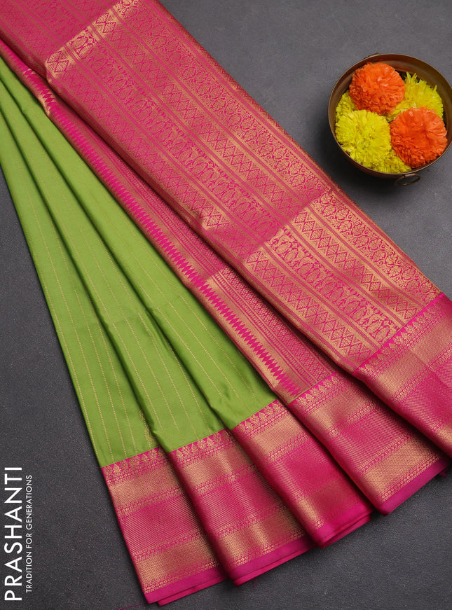 Semi soft silk saree light green and pink with allover zari weaves & paisley buttas and zari woven border