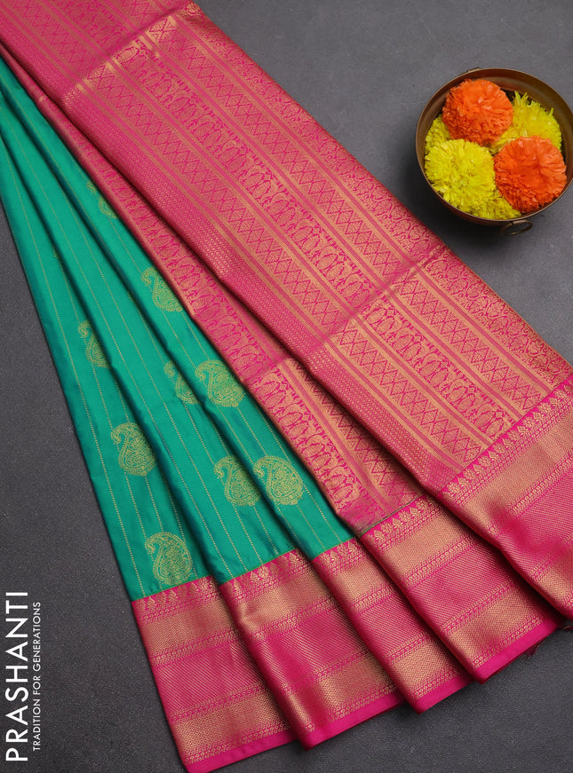 Semi soft silk saree green and pink with allover zari weaves & paisley buttas and zari woven border