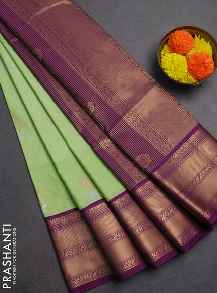 Semi soft silk saree light green and purple with allover silver & gold zari woven buttas and zari woven border