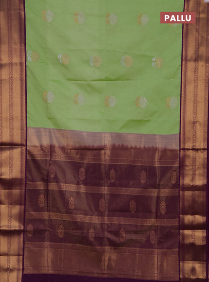 Semi soft silk saree light green and purple with allover silver & gold zari woven buttas and zari woven border