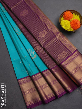 Semi soft silk saree teal green and purple with allover silver & gold zari woven buttas and zari woven border