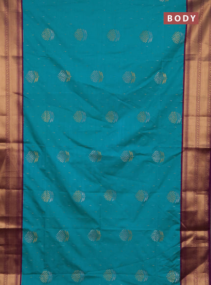 Semi soft silk saree teal green and purple with allover silver & gold zari woven buttas and zari woven border