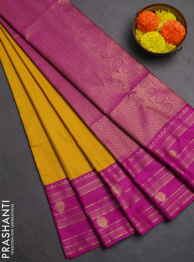 Semi soft silk saree mustard yellow and magenta pink with allover zari woven buttas and rettapet zai woven butta border