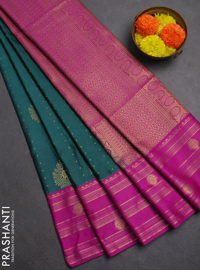 Semi soft silk saree peacock green and magenta pink with allover zari woven buttas and rettapet zai woven butta border