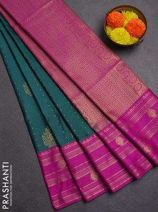 Semi soft silk saree peacock green and magenta pink with allover zari woven buttas and rettapet zai woven butta border