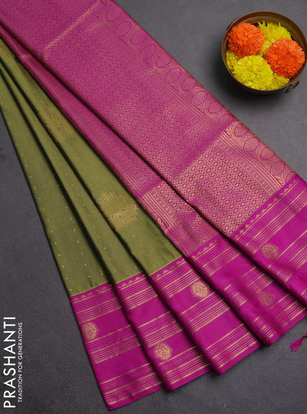 Semi soft silk saree mehendi green and magenta pink with allover zari woven buttas and rettapet zai woven butta border