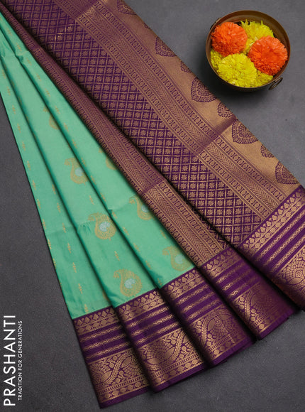 Semi soft silk saree light green and purple with allover silver & gold zari woven buttas and zari woven border