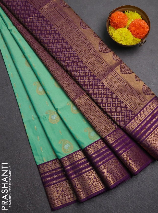 Semi soft silk saree light green and purple with allover silver & gold zari woven buttas and zari woven border