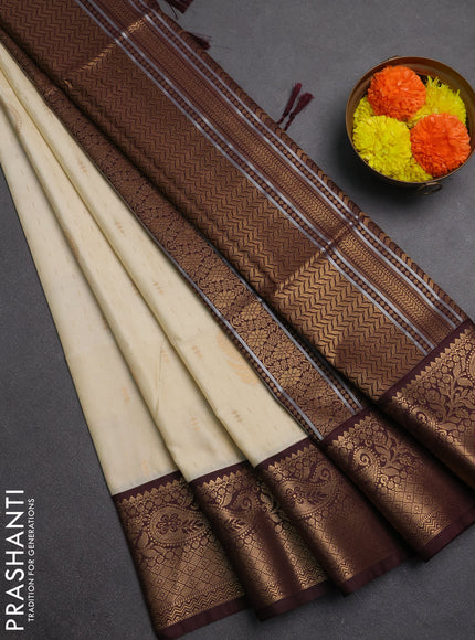 Semi soft silk saree off white and coffee brown with allover zari weaves & buttas and zari woven border
