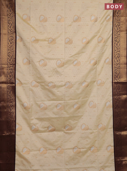 Semi soft silk saree off white and coffee brown with allover zari weaves & buttas and zari woven border