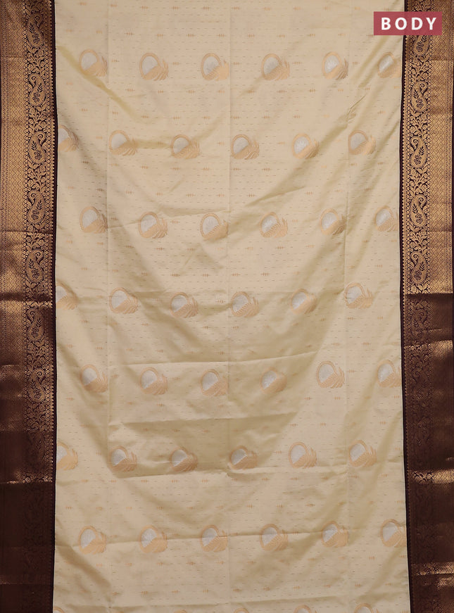 Semi soft silk saree off white and coffee brown with allover zari weaves & buttas and zari woven border