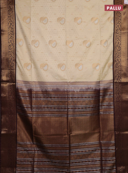 Semi soft silk saree off white and coffee brown with allover zari weaves & buttas and zari woven border