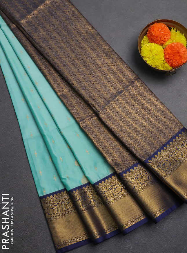 Semi soft silk saree teal shade and navy blue with allover zari woven buttas and rettapet zari woven border
