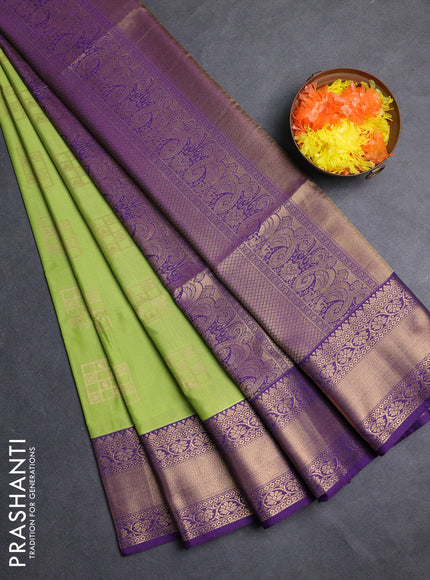 Semi soft silk saree green and purple with allover zari woven buttas and zari woven border