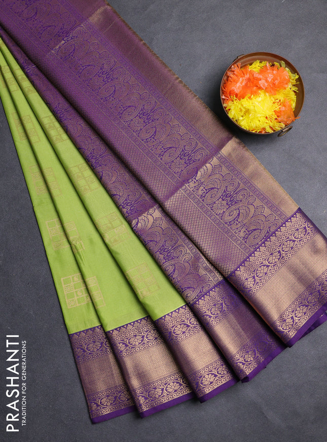 Semi soft silk saree green and purple with allover zari woven buttas and zari woven border