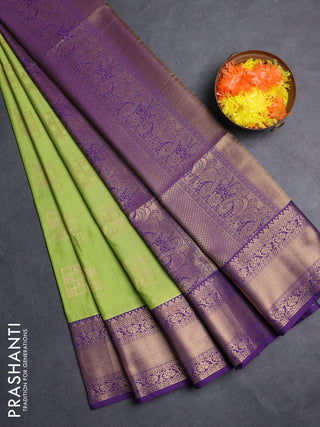Semi soft silk saree green and purple with allover zari woven buttas and zari woven border