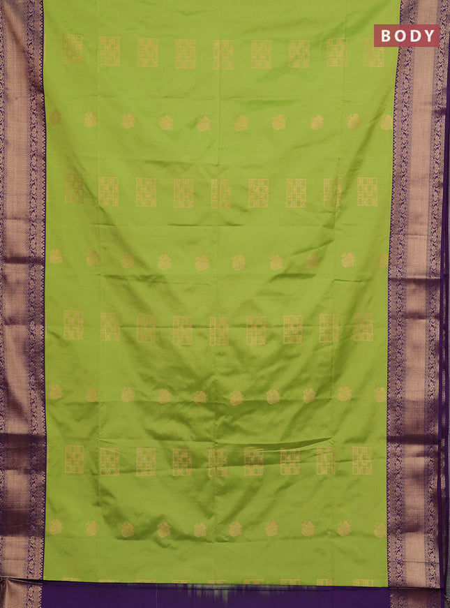 Semi soft silk saree green and purple with allover zari woven buttas and zari woven border